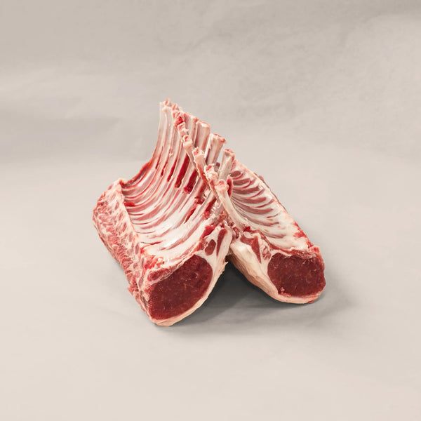 Artisan Rack of Lamb showcasing elegant hand-trimmed cuts, perfect for gourmet dining experiences.